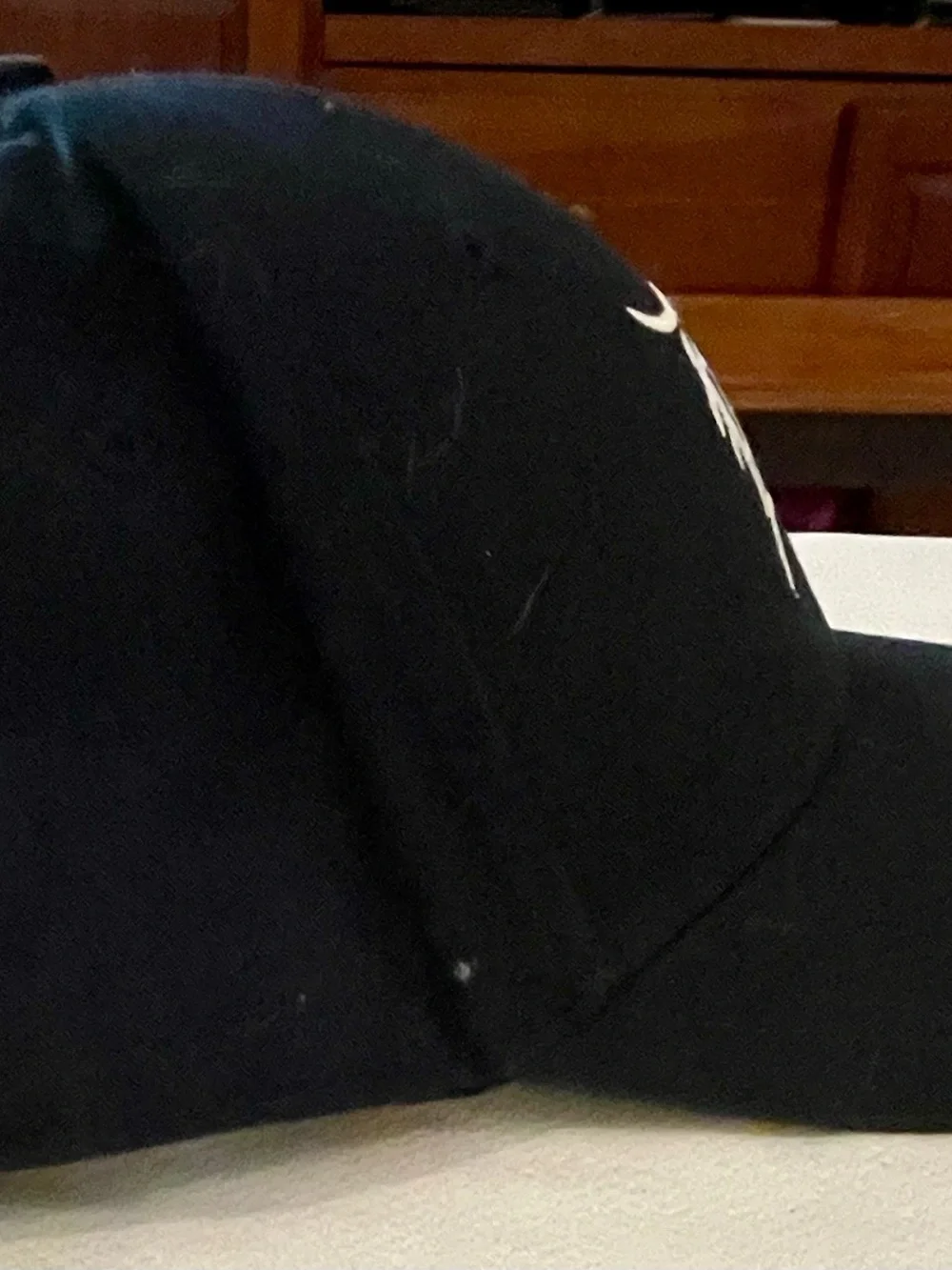 Genuine Merchandise Black Cap with White Logo Tag
